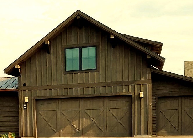 Medium-sized farmhouse with a three-car attached garage