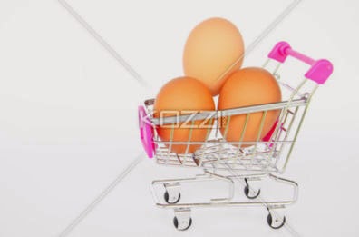 Eggs In The Shopping Cart On White Background